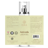 Stretched label on a bottle of Anirveda essential oils.